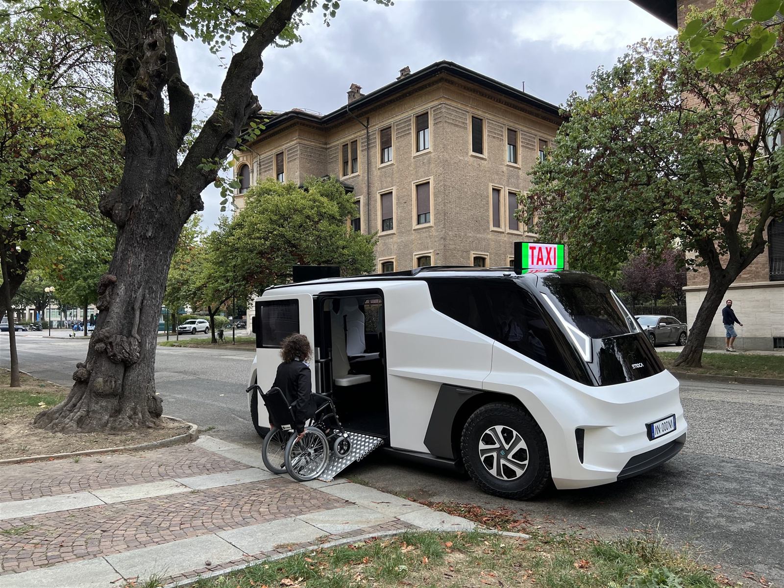 A wheelchair user boarding the ETIOCA prototype by its ramp